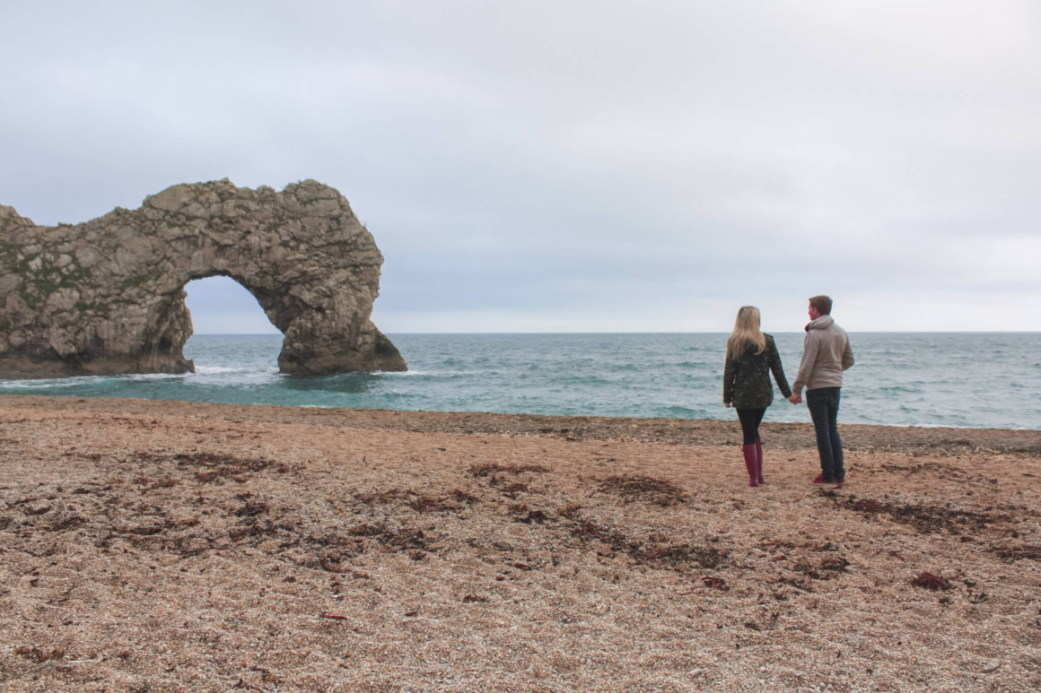 walking along the beach at durdle door on the Jurassic coast of England